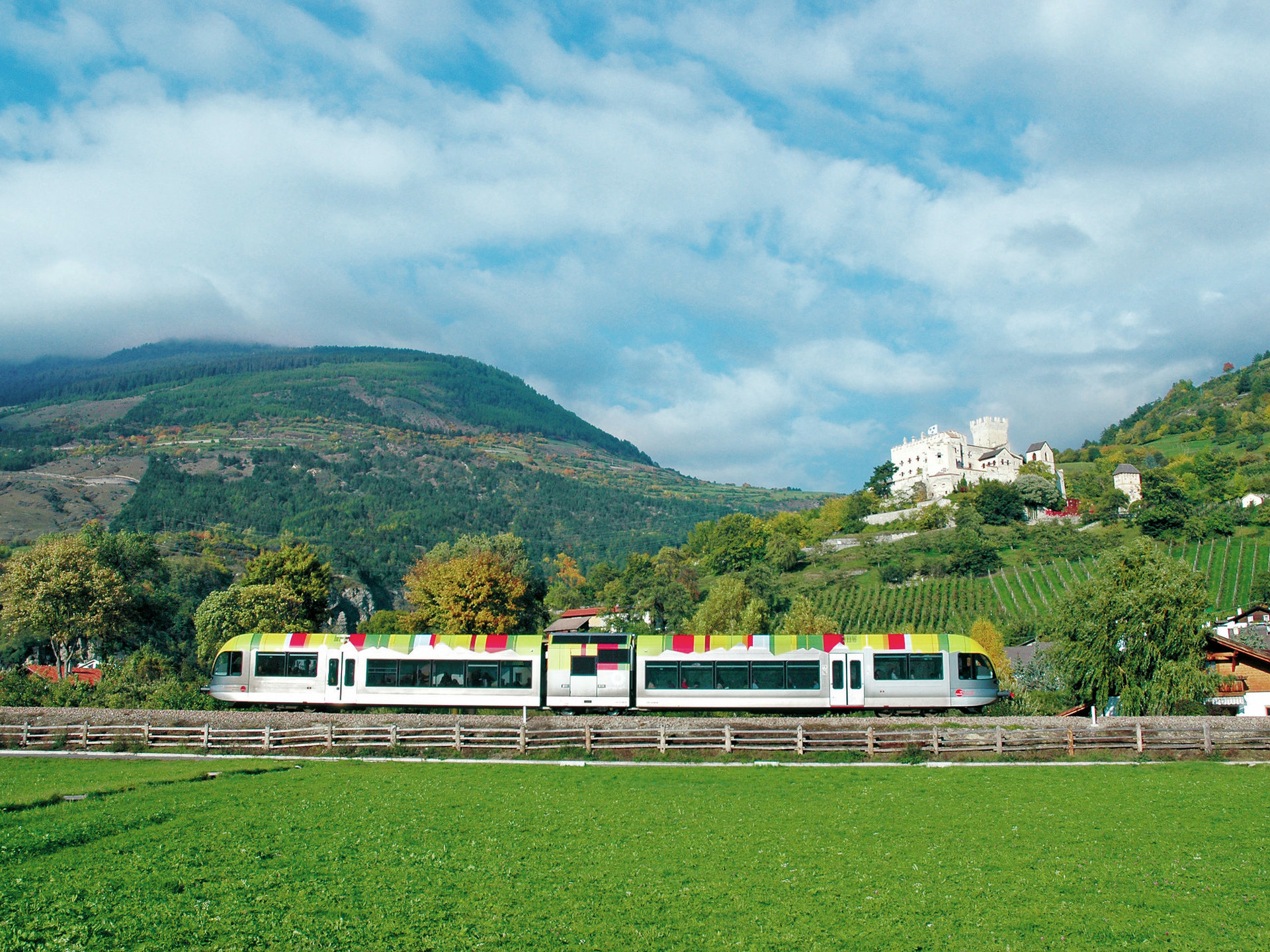 The Venosta Valley railway and in the background the Churburg Castle in Schluderns/Sluderno
